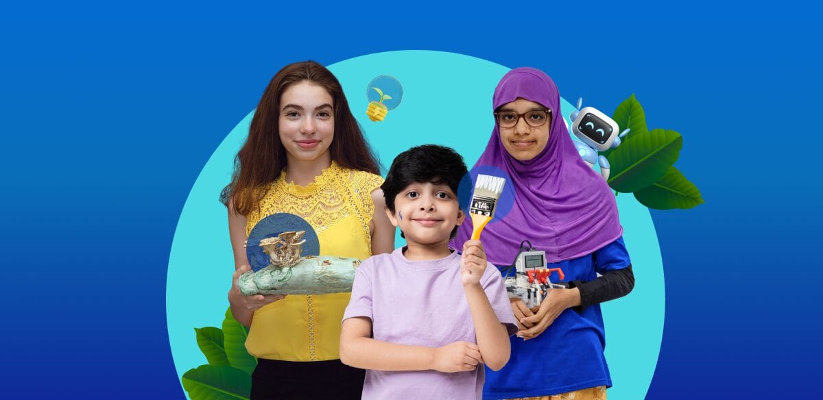 Una niña con un proyecto artístico, un niño con un pincel y una niña sosteniendo un pequeño robot.